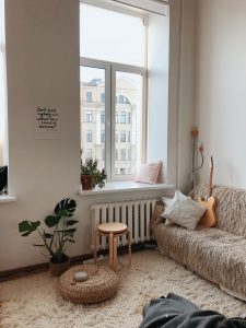 Alt. tag: A bright, cozy apartment with light-colored furniture
