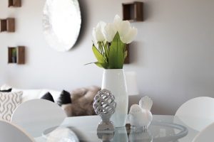 Some flowers in a vase on the table.