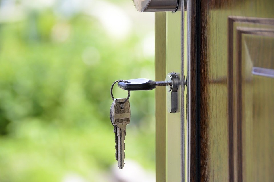 a house key stuck in a door knob.