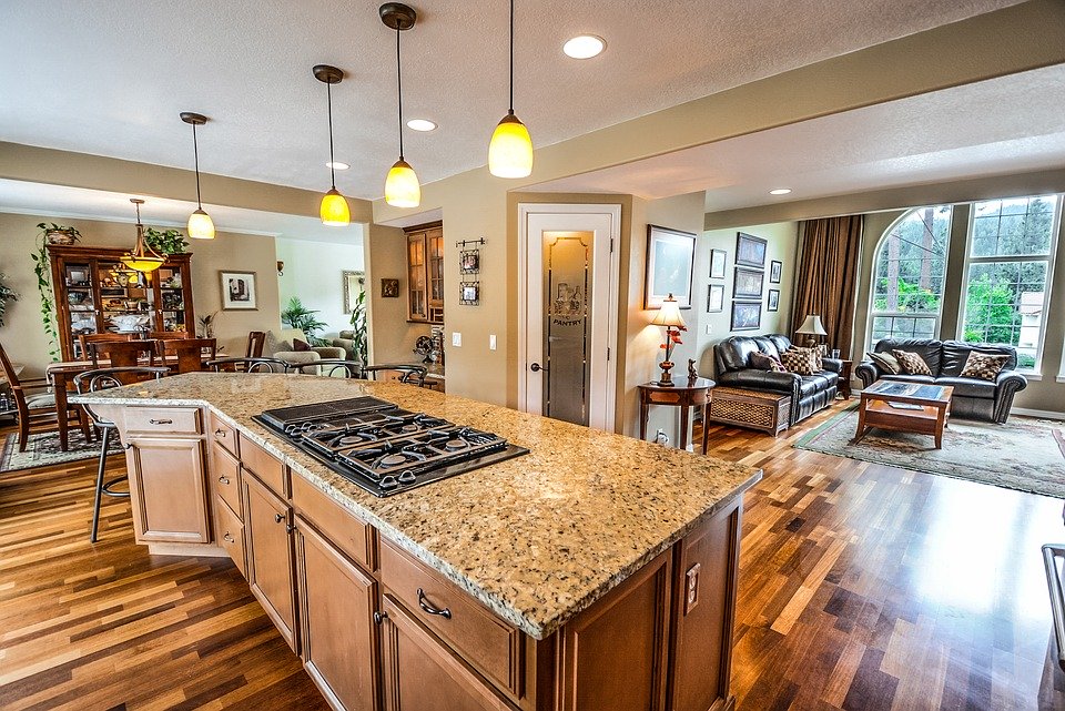  a beautiful and spacious kitchen that extends into an even larger living room.