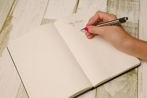 A woman writing a plan