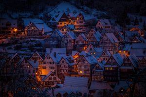 A mountainous town at night.