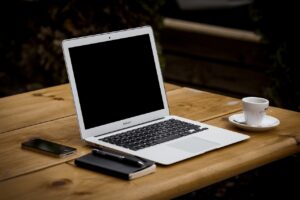 A laptop on a desk before one starts doing research on North York real estate predictions for 2022