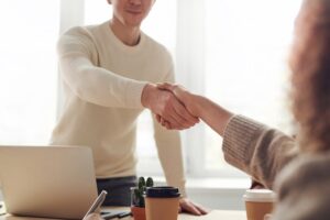 A handshake with a realtor while house hunting in Kuwait.