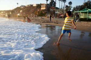Kids playing in one of the luxury real estate market in California.