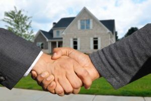 A handshake after buying a house in a different state