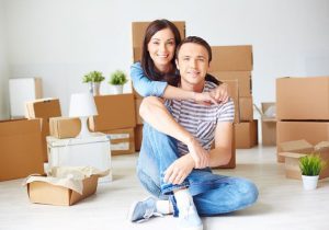 A couple with boxes is ready for an apartment relocation in Rutherford, NJ.